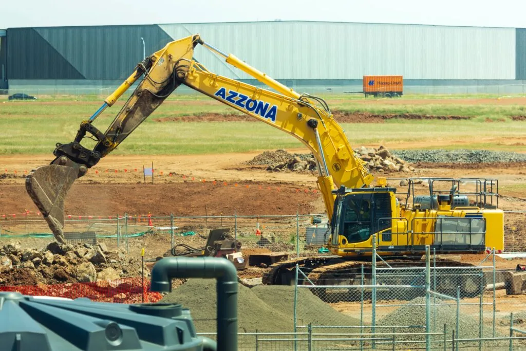 An Excavator digging a trench