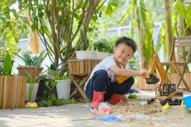 Child Play With Toy Excavator