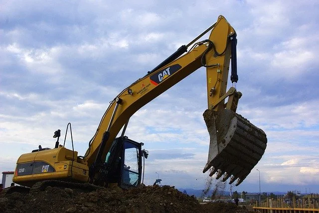 View on motor of new excavator digging