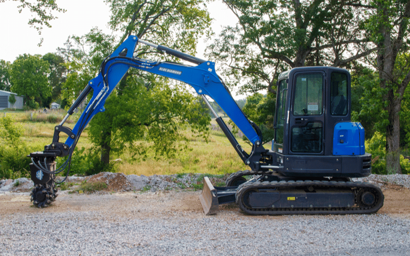 Blue Kobelco Excavator with the Rock Breaker Attachment