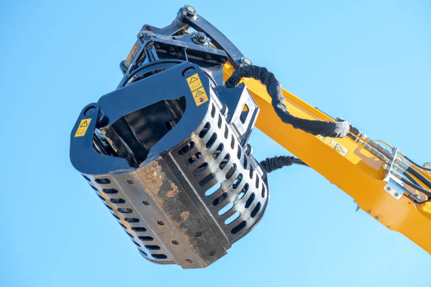Screening bucket of a construction equipment with blue sky as the background